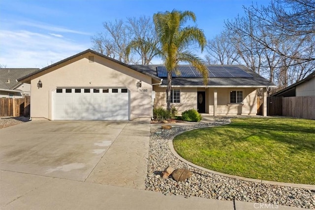 ranch-style home with a front yard, a garage, and solar panels