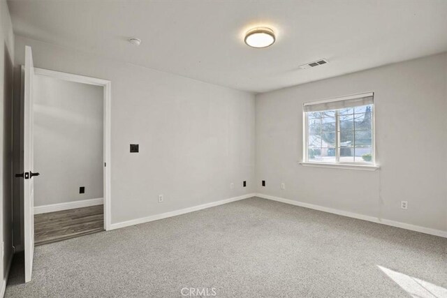 empty room featuring carpet flooring