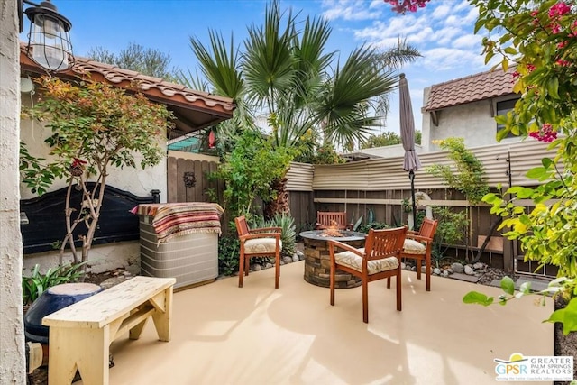 view of patio with an outdoor fire pit