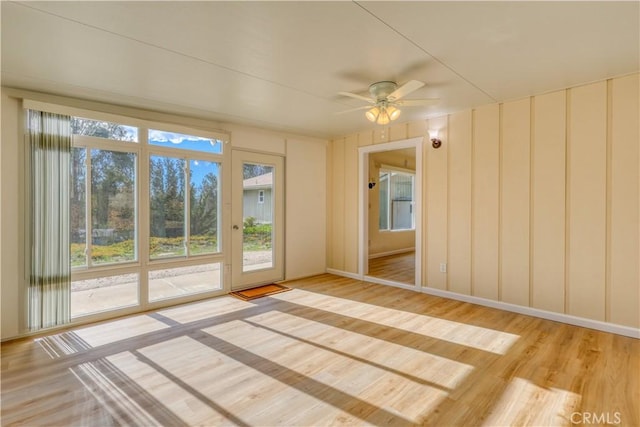 empty room featuring ceiling fan and wood-type flooring