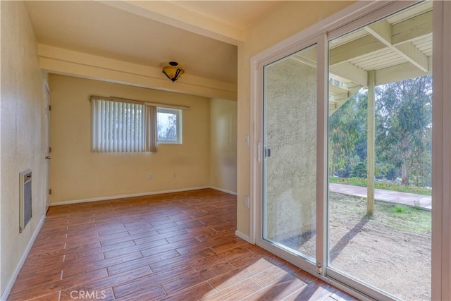 doorway to outside with wood-type flooring