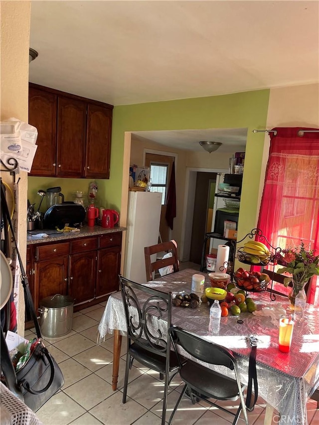 dining area with light tile patterned flooring