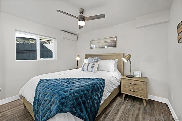 bedroom with an AC wall unit, ceiling fan, and dark hardwood / wood-style flooring