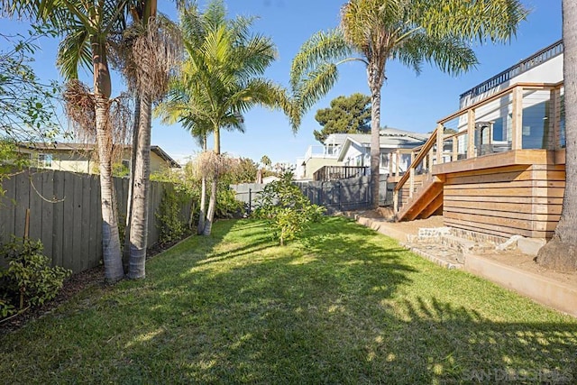 view of yard with a wooden deck