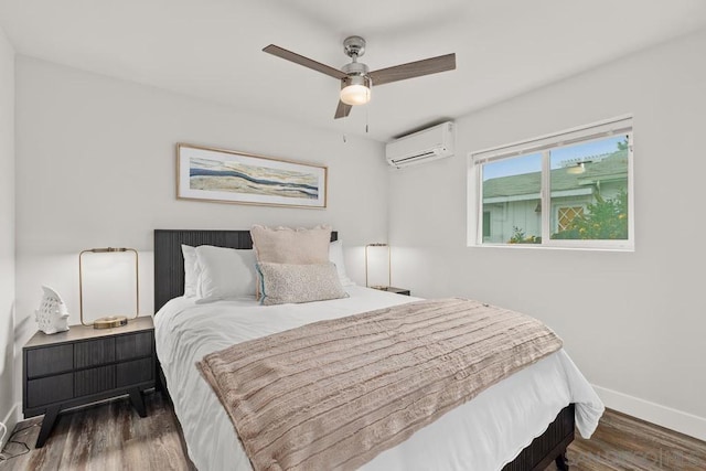 bedroom featuring ceiling fan, dark hardwood / wood-style flooring, and a wall unit AC