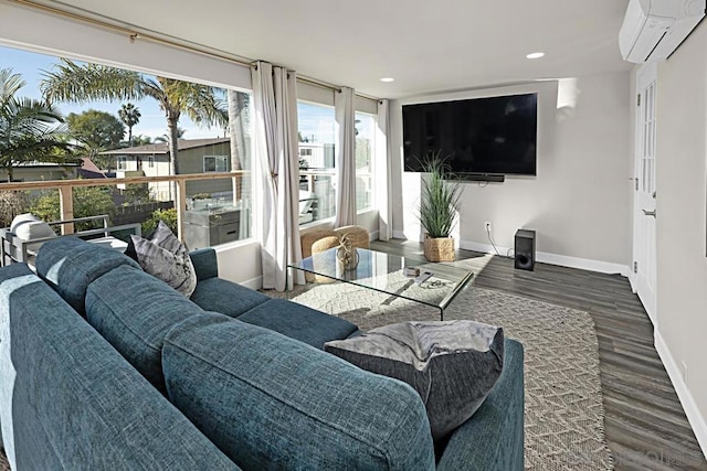 living room featuring dark hardwood / wood-style floors and a wall unit AC