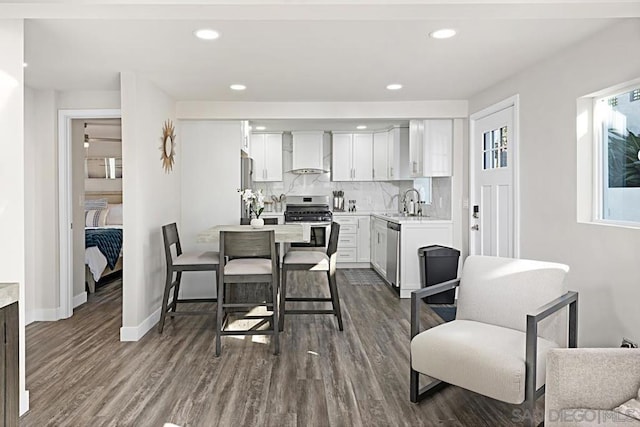 dining space with dark wood-type flooring