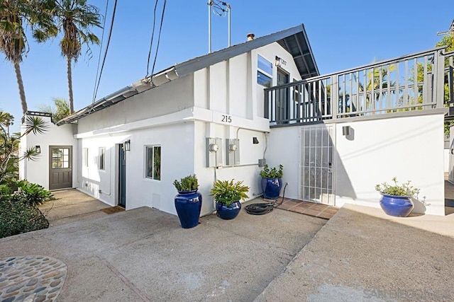 rear view of property with a patio area