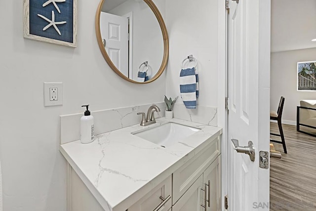 bathroom with wood-type flooring and vanity