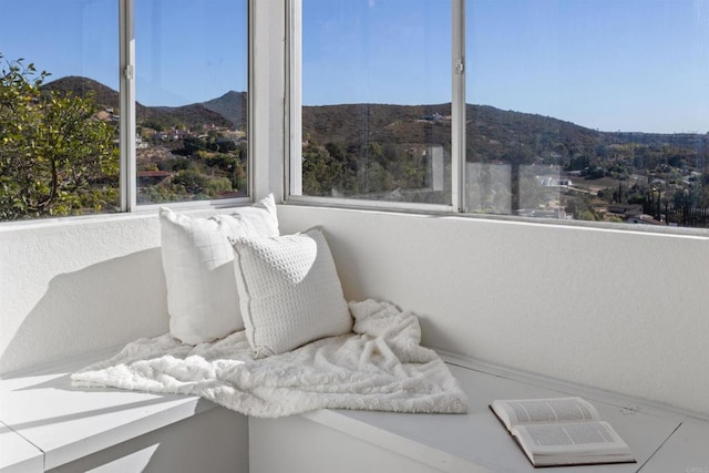 sunroom / solarium with a mountain view