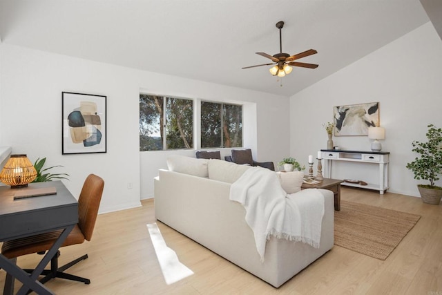 living room featuring lofted ceiling, ceiling fan, and light hardwood / wood-style flooring