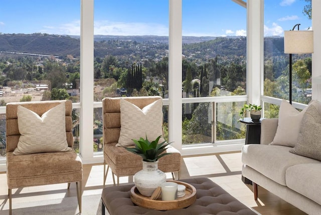 sunroom featuring a mountain view