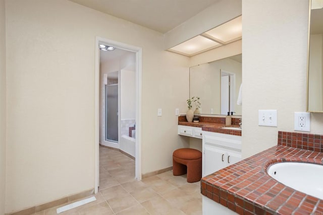 bathroom featuring tile patterned flooring and vanity