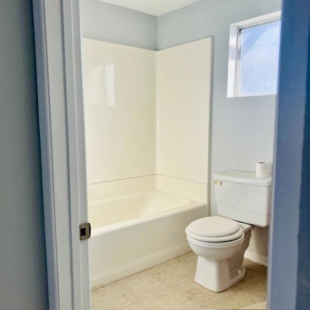 bathroom featuring tile patterned floors and toilet