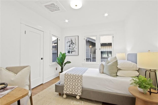 bedroom with light wood-type flooring