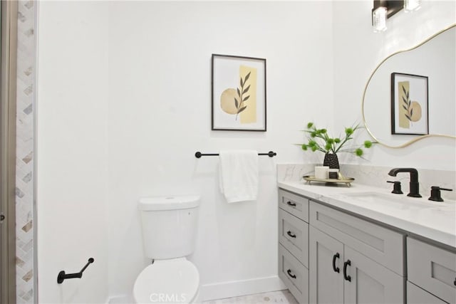 bathroom with tile patterned floors, vanity, and toilet