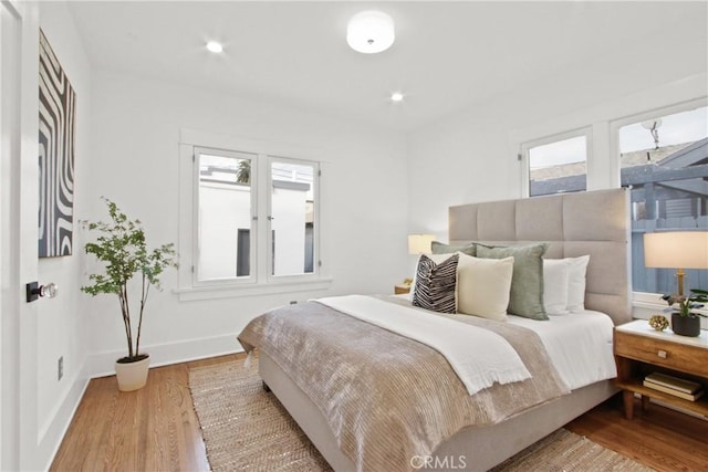 bedroom with hardwood / wood-style floors