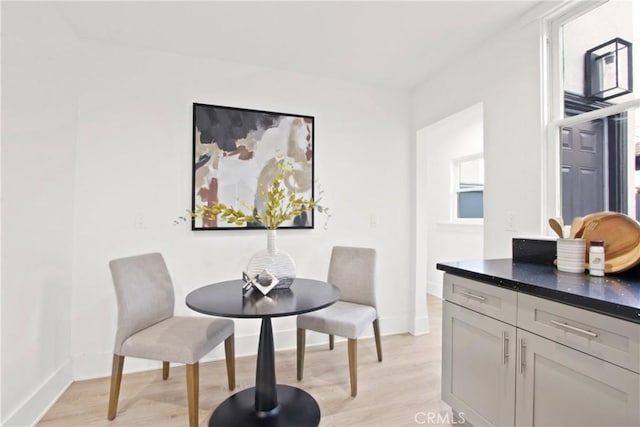 dining area with light hardwood / wood-style floors