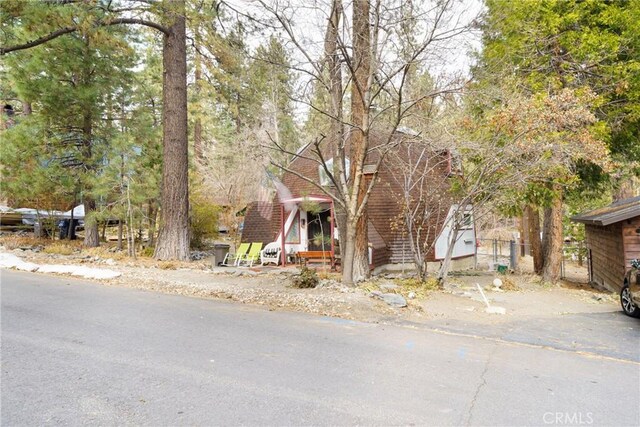 view of property hidden behind natural elements