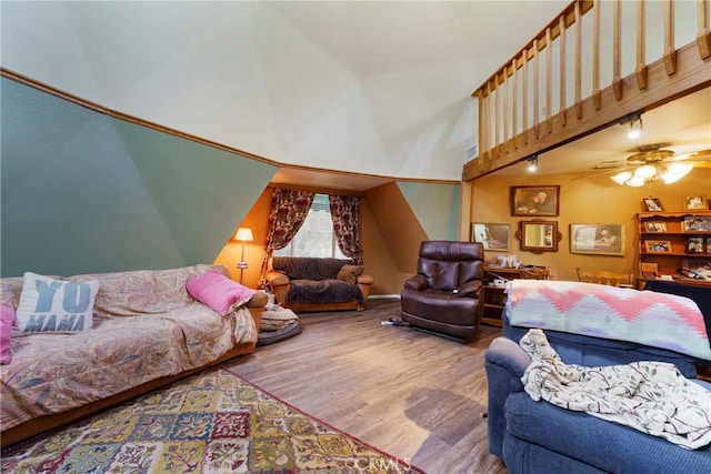 living room featuring ceiling fan and wood-type flooring