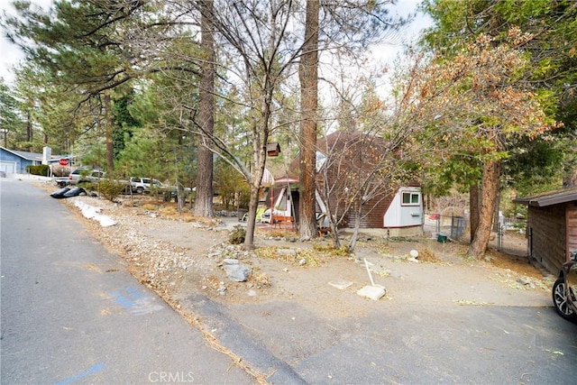 view of property hidden behind natural elements