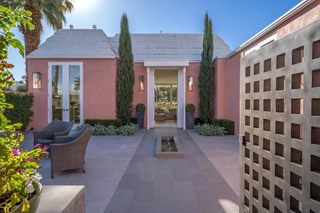 doorway to property with french doors and a patio