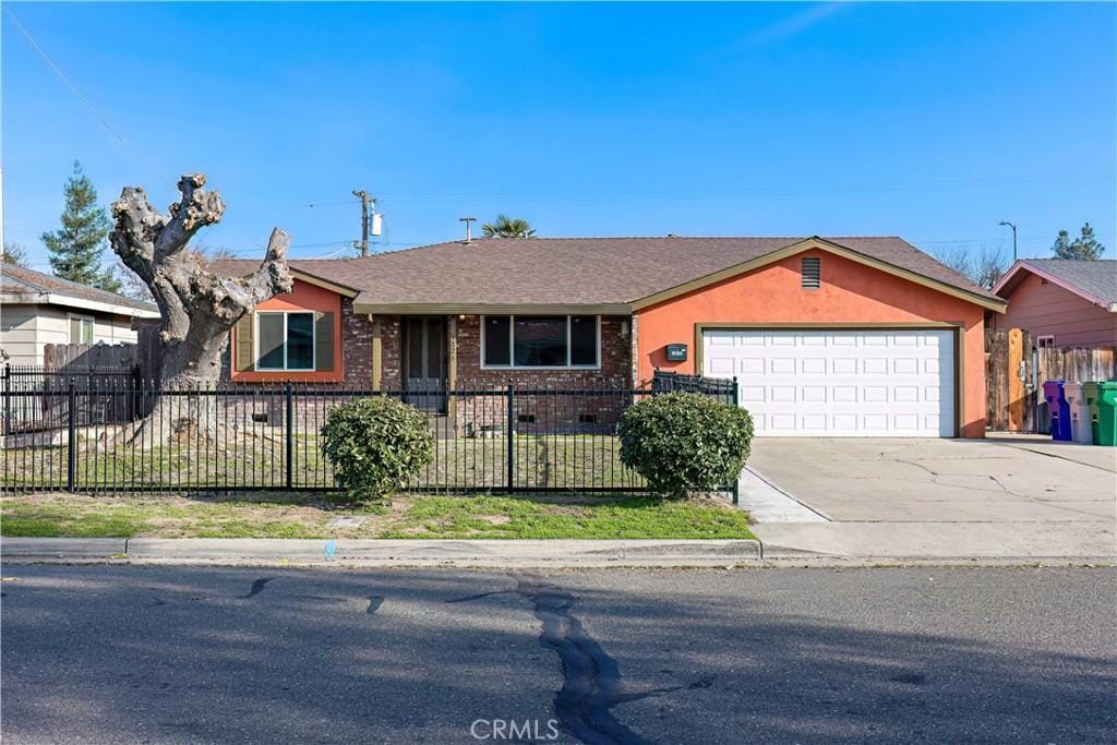 single story home featuring a garage