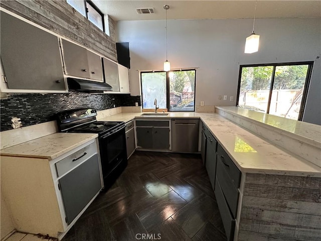 kitchen with pendant lighting, dishwasher, sink, black range with electric cooktop, and kitchen peninsula