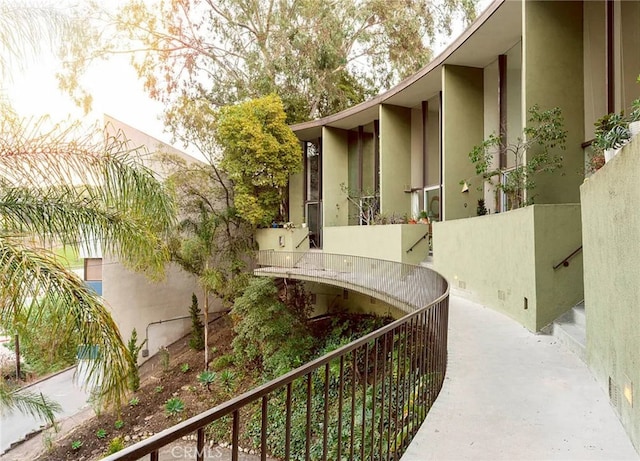 view of side of home with a balcony