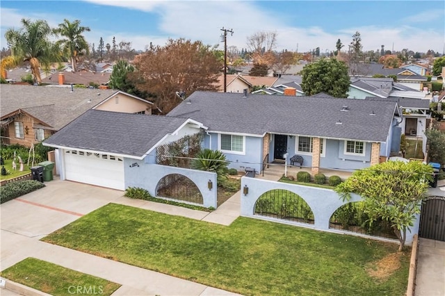 view of front of home with a front lawn and a garage