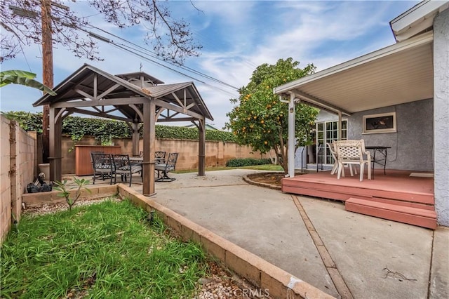 view of patio / terrace featuring a gazebo and a wooden deck