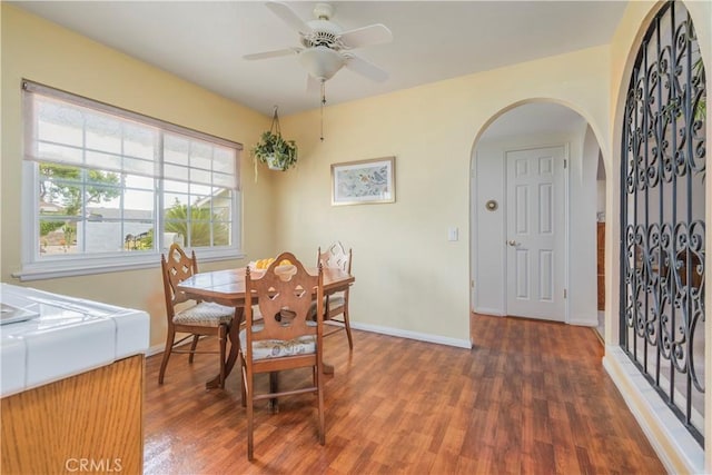 dining room featuring dark hardwood / wood-style floors and ceiling fan