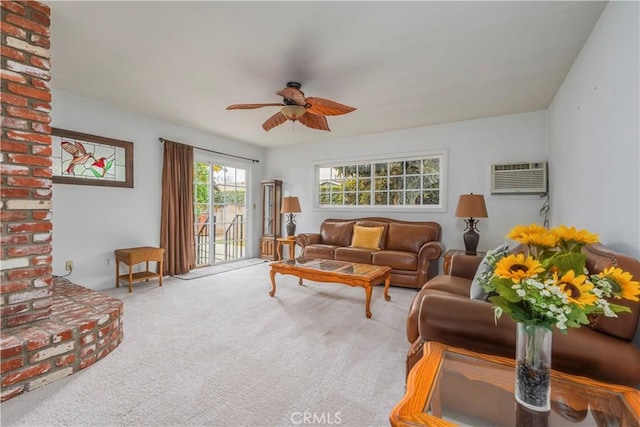 carpeted living room with ceiling fan and a wall mounted AC