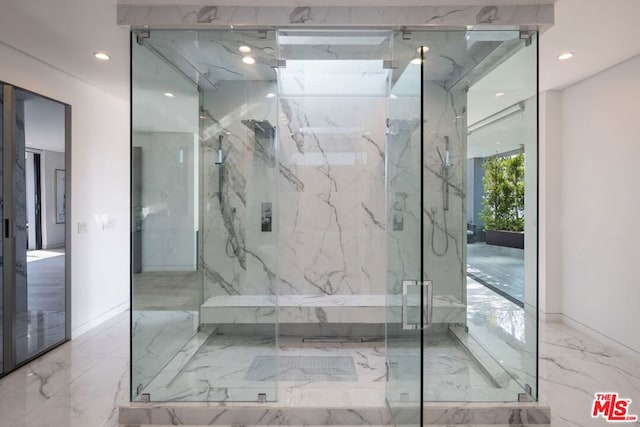 bathroom featuring a shower with door