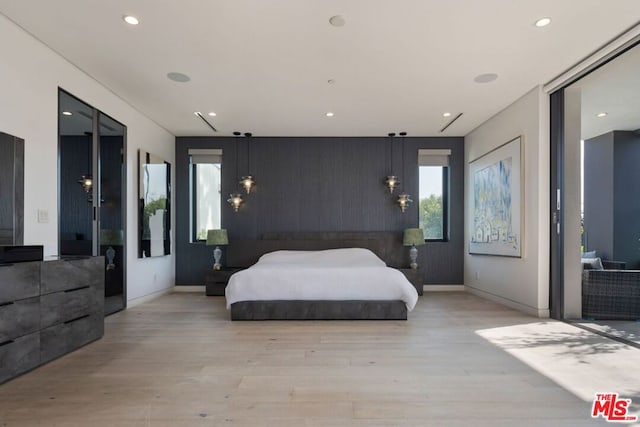 bedroom with light wood-type flooring