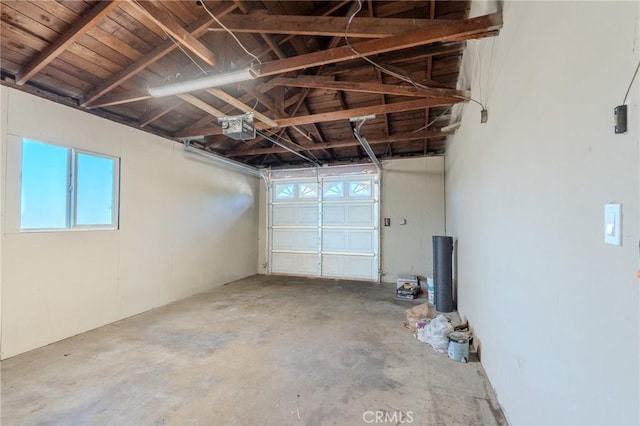 garage with a garage door opener and wooden ceiling