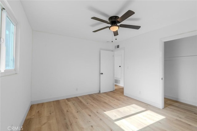 unfurnished bedroom with a closet, ceiling fan, and light hardwood / wood-style flooring