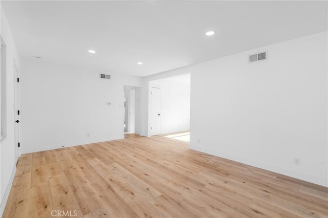 spare room featuring light hardwood / wood-style floors