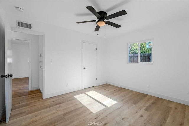 unfurnished bedroom featuring ceiling fan and light wood-type flooring