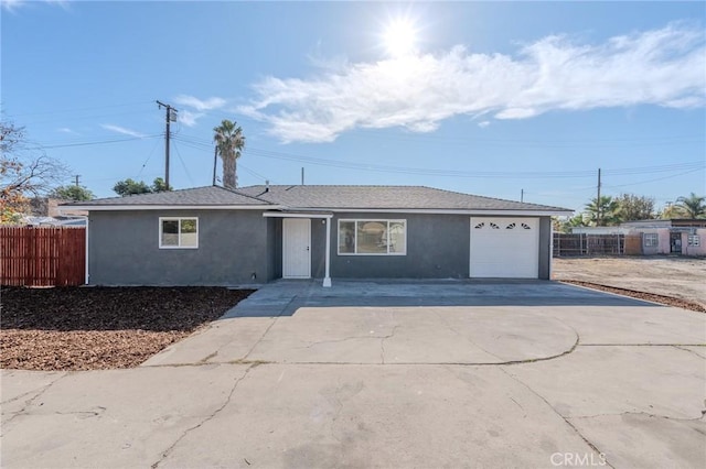 single story home featuring a garage