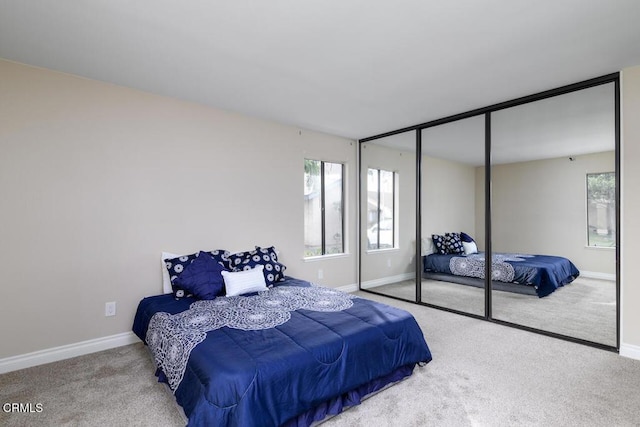 carpeted bedroom featuring a closet