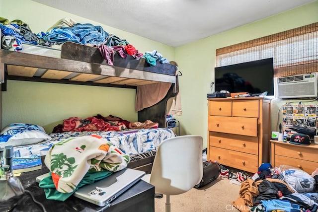 carpeted bedroom with a wall unit AC