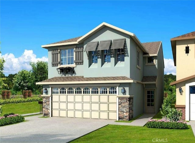 view of front of property with a garage and a front lawn