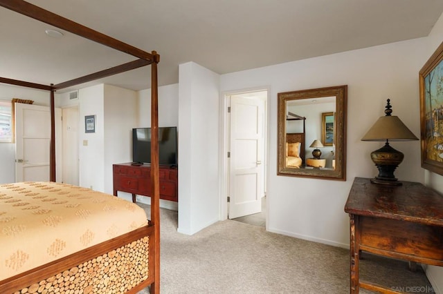 bedroom featuring light carpet