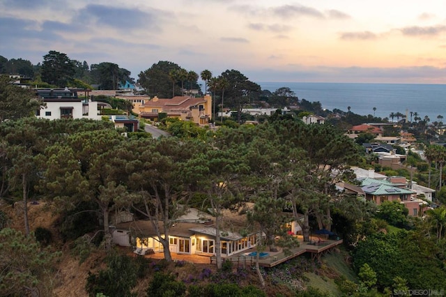 aerial view at dusk with a water view