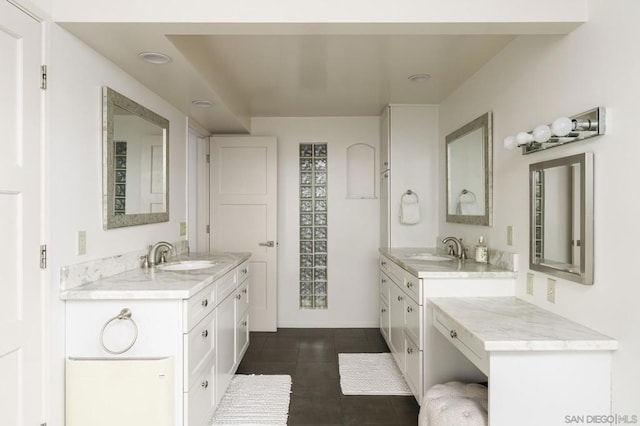 bathroom featuring tile patterned flooring and vanity