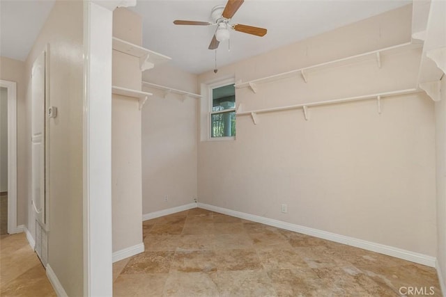 spacious closet featuring ceiling fan