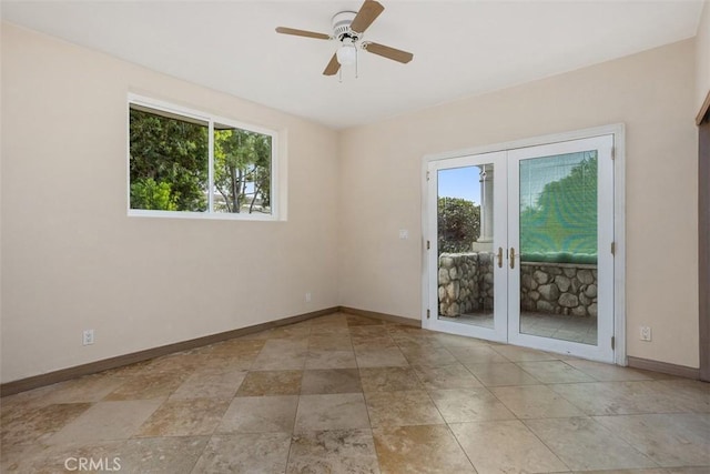 spare room featuring french doors and ceiling fan