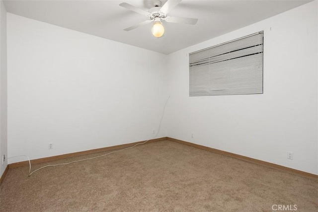 empty room with carpet and ceiling fan