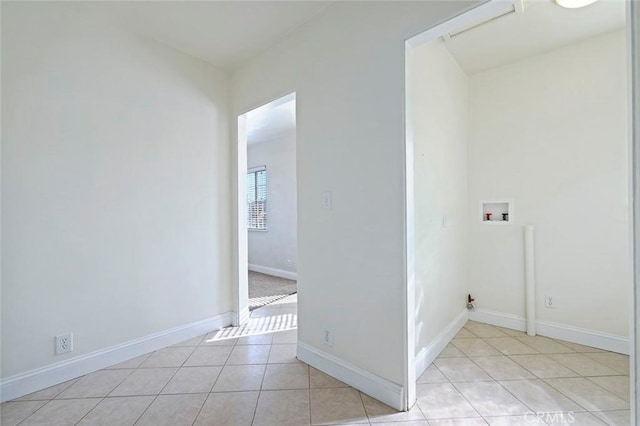 laundry area with hookup for a washing machine and light tile patterned floors